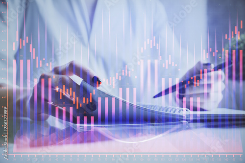 Financial chart drawn over hands taking notes background. Concept of research. Multi exposure © peshkova