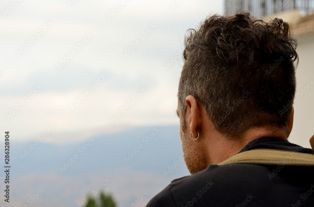 Lonely man watching the landscape Lonely man watching the landscape