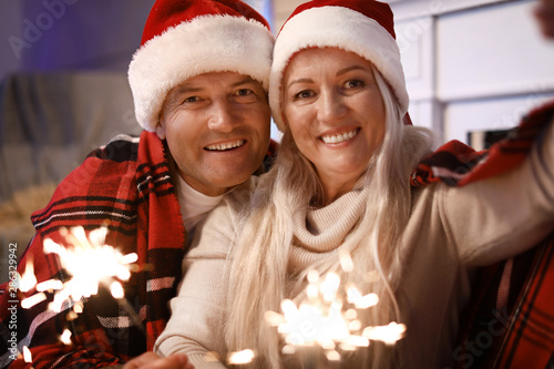 Happy mature couple with Ch...