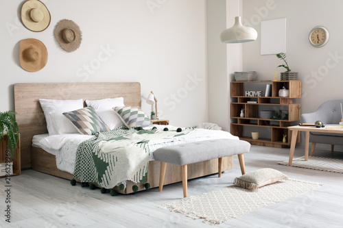 Stylish interior of comfortable bedroom photo