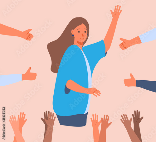 Happy young woman is standing and she is surrounded by hands with thumbs up.