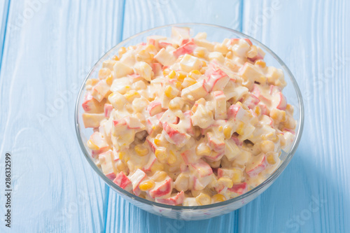 Salad with crab sticks , corn , eggs and mayonnaise