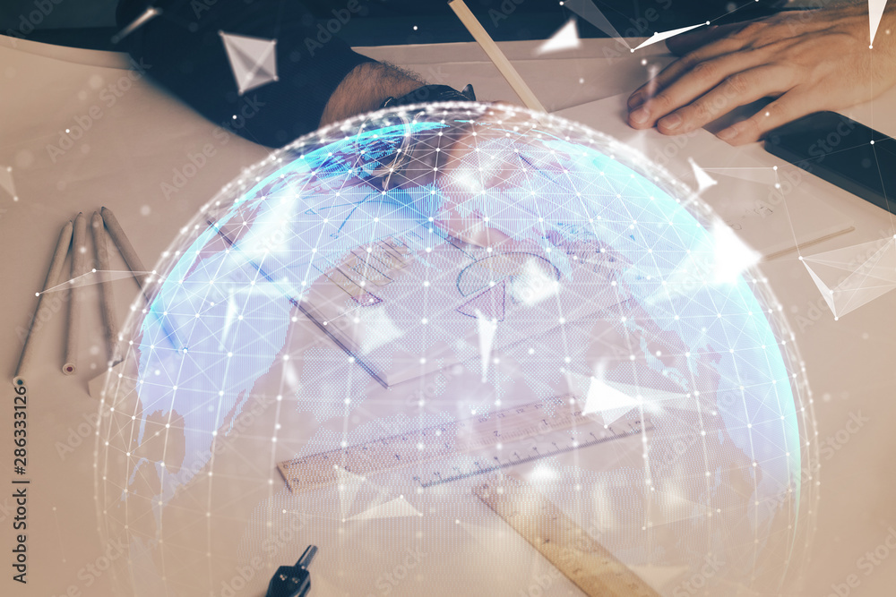 Double exposure of hands and notepad with business icons. Double exposure of hands and notepad with business icons.