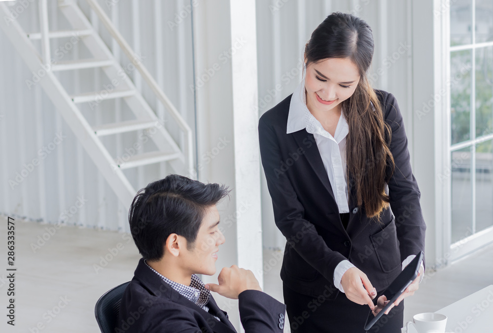 Young businessmen are talking in a modern office. Team work concept Young businessmen are talking in a modern office. Team work concept