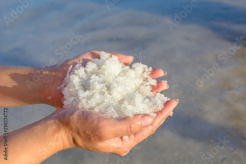 A handful of salt from a salt lake. Salt mine.