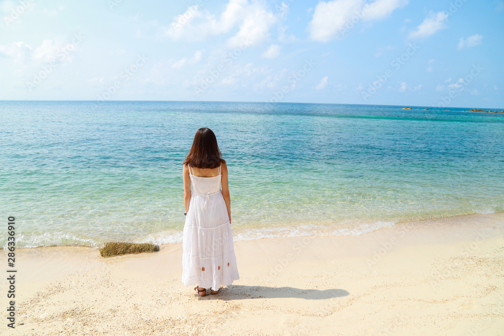 A beautiful broken heart women is alone and feel down on the beach.Valentine's concept. A beautiful broken heart women is alone and feel down on the beach.Valentine's concept.