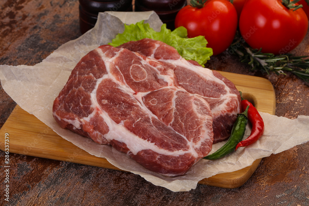 Raw pork neck steak