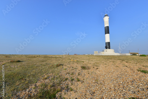 Modern lighthouse at Dungeness in summertime.