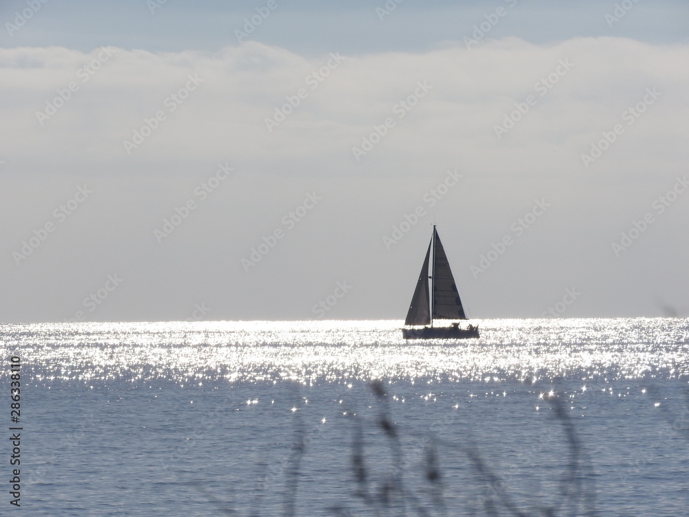 Sailboat far away on the sea