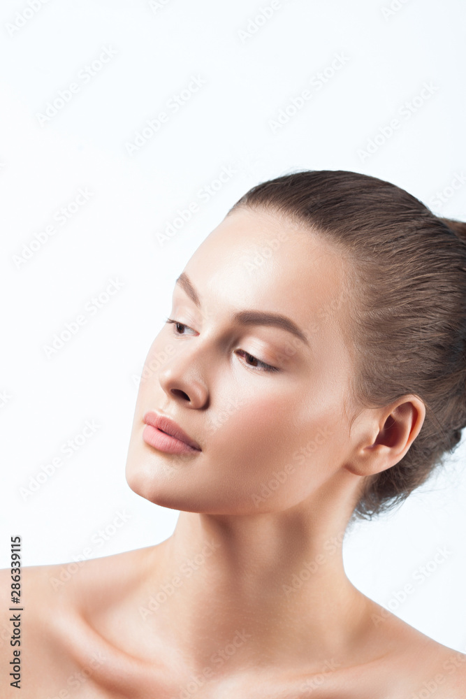 Young beautiful woman with clean perfect skin close-up