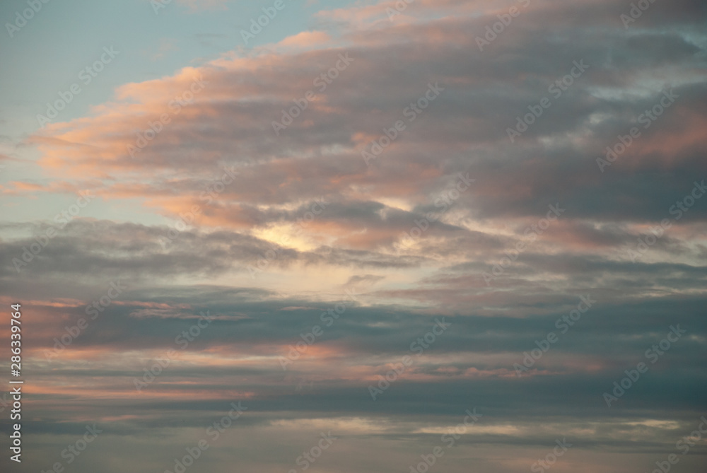 Beautiful sky with cloud before sunset. The softness of the clouds and the brightness of the sky. Light blue background. Relaxing feeling and inspirational.