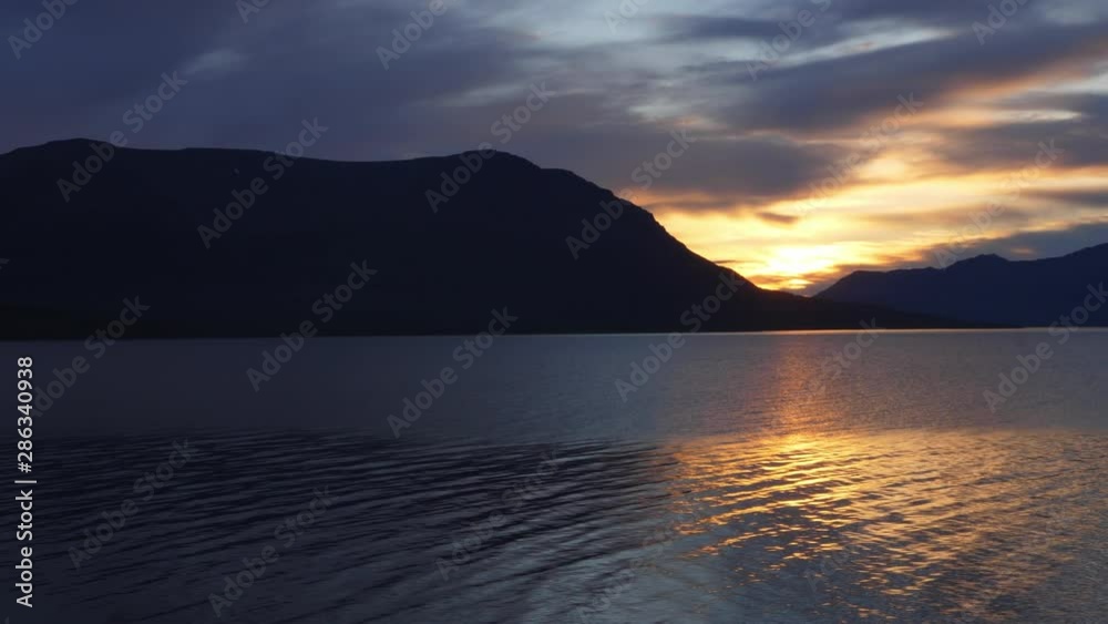 Lonely mountain. A walk along the shore, a fisherman's dream. Beautiful evening sunset Lonely mountain. A walk along the shore, a fisherman's dream. Beautiful evening sunset