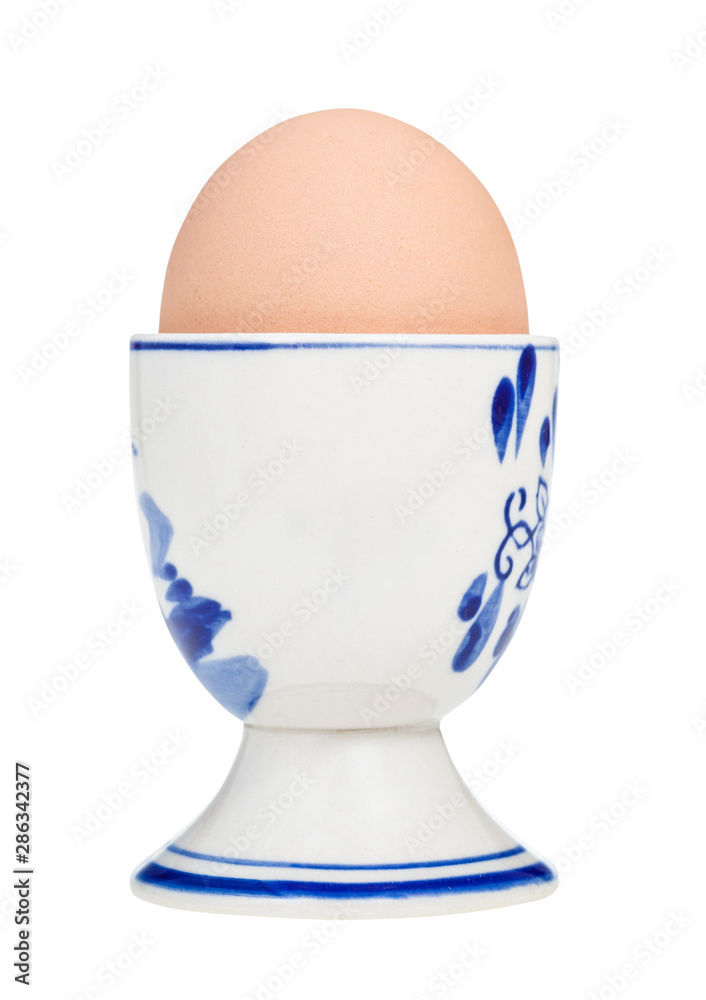brown boiled egg in cup with a blunt end up brown boiled egg in cup with a blunt end up