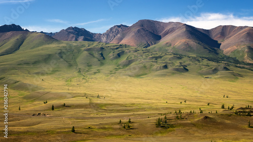 mountain panorama of Chui mountain range in Altai with snow, Russia, June