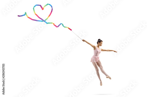 Ballerina dancing and making a heart shape with a ribbon