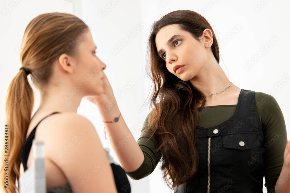 Make up artist applies eye shadows. Hand of make-up master, painting model eyes Make up artist applies eye shadows. Hand of make-up master, painting model eyes