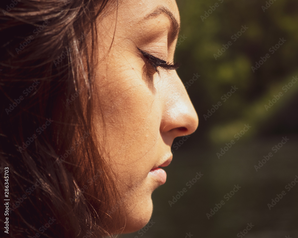 pensive young woman with olive skin pensive young woman with olive skin
