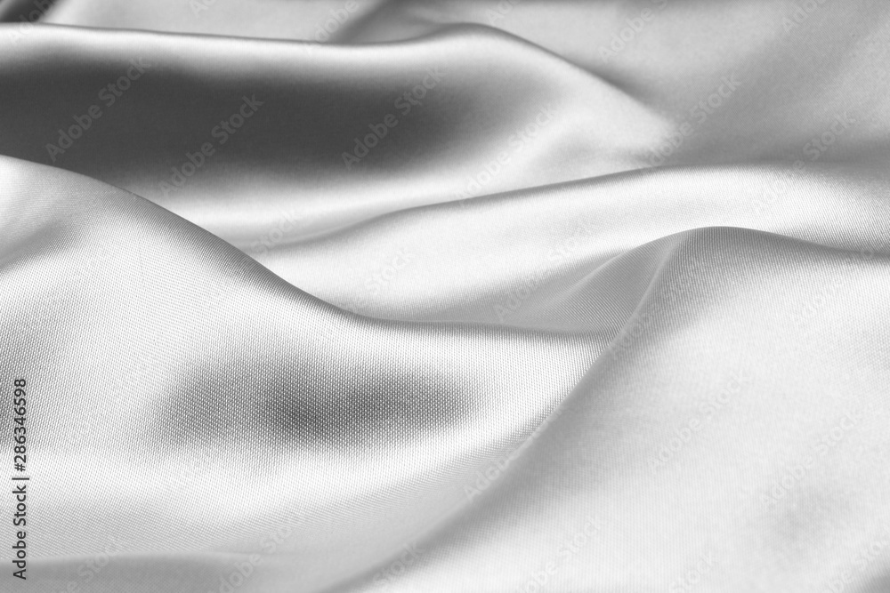Silver wavy silk background texture Silver wavy silk background texture