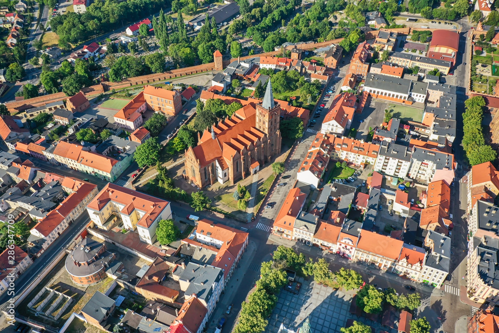 Aerial view of a Gothic church in a small town in Europe