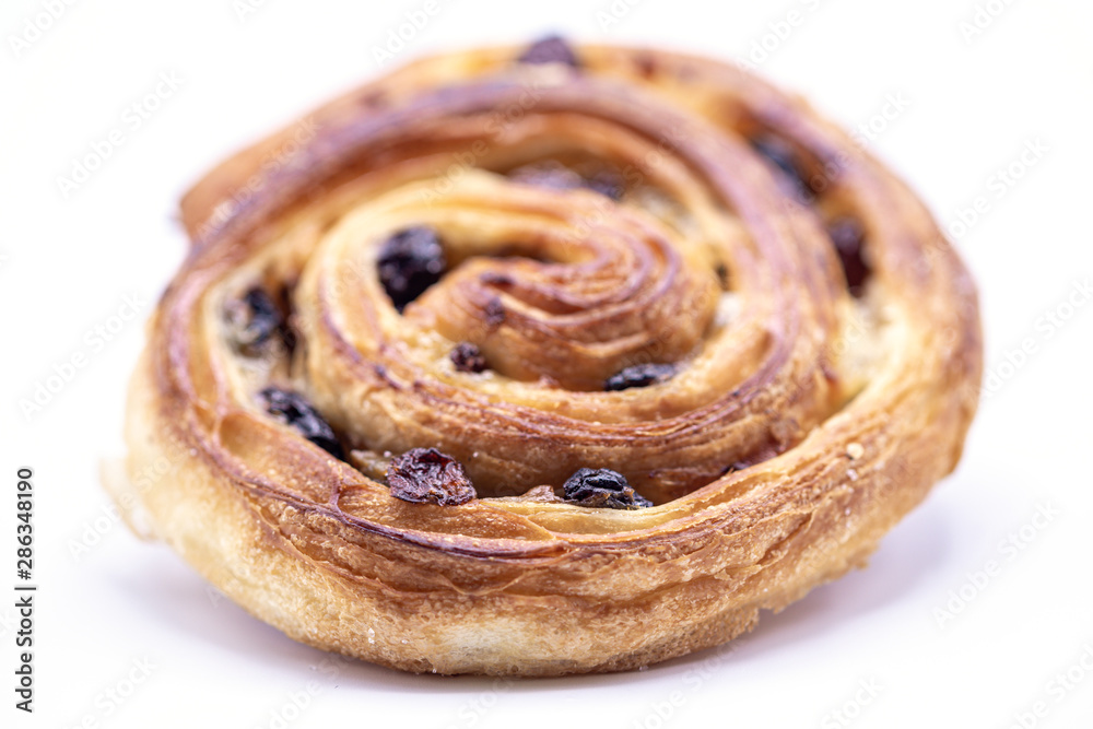 Raisin Danish pastry on wooden plate background. Raisin Danish pastry on wooden plate background.