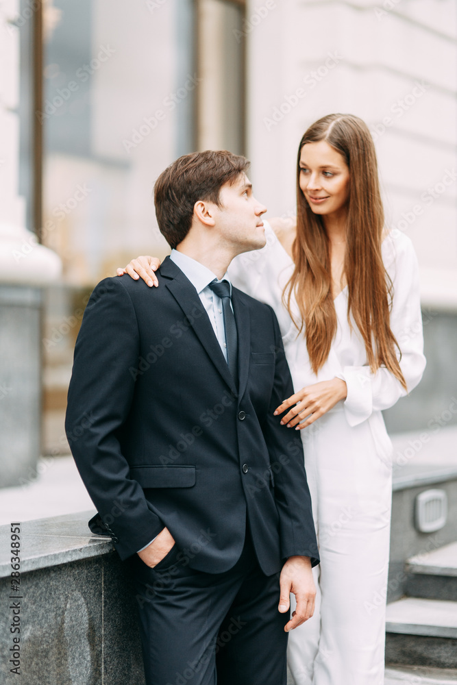 love story in the European style. happy couple on the background of the evening city. love story in the European style. happy couple on the background of the evening city.