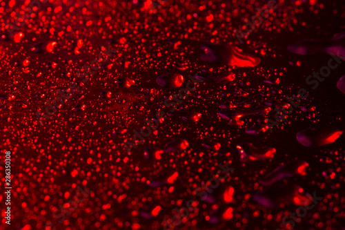 Texture of water droplets in red. Makro, close-up.