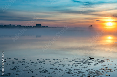 Sunrise with the mist above a river,  summer morning in Jurmala - famous tour...