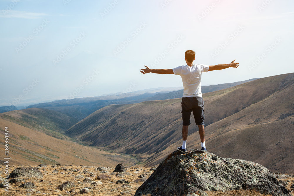 traveler man openning hand  under sky