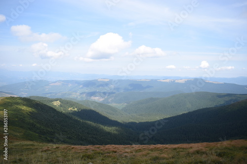 View while climbing Mount Hoverla. View of the mountain, forests and clouds. Ukrainian Carpathians. © Руслан Спашиба