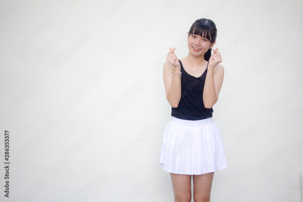 Portrait of thai adult student university uniform beautiful girl give heart Portrait of thai adult student university uniform beautiful girl give heart