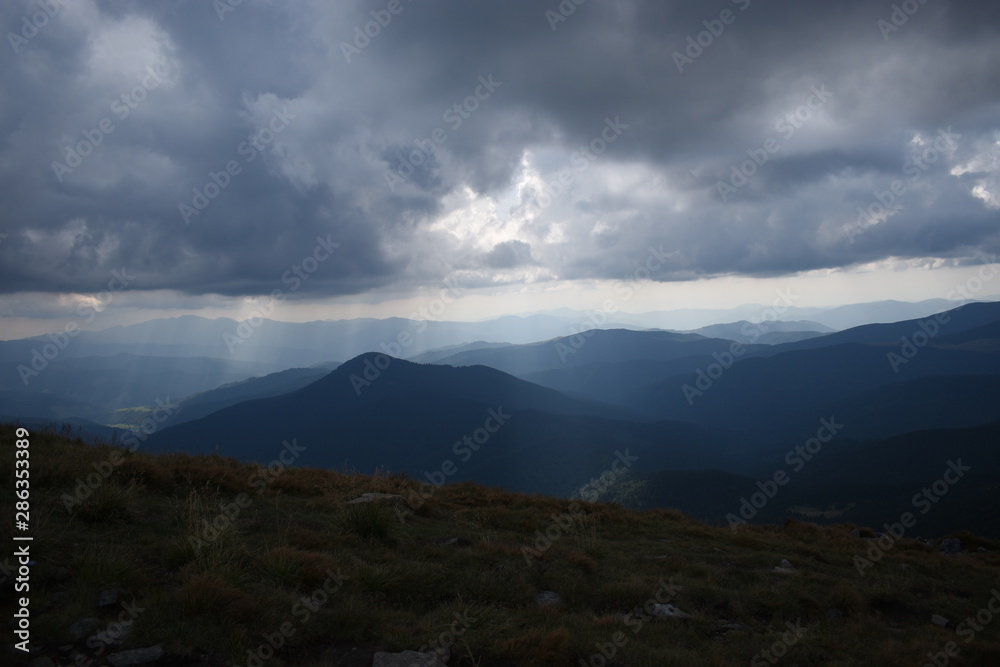 View while climbing Mount Hoverla. View of the mountain, forests and clouds. Ukrainian Carpathians. View while climbing Mount Hoverla. View of the mountain, forests and clouds. Ukrainian Carpathians.