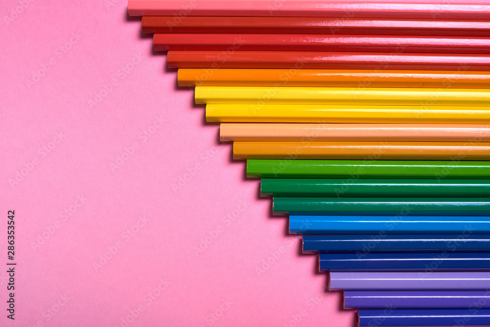 Color pencils on pink pastel background, close up. Set of colorful pencils, copy space. Crayons. Top view, flat lay. Back to school, college concept. Abstract background Color pencils on pink pastel background, close up. Set of colorful pencils, copy space. Crayons. Top view, flat lay. Back to school, college concept. Abstract background