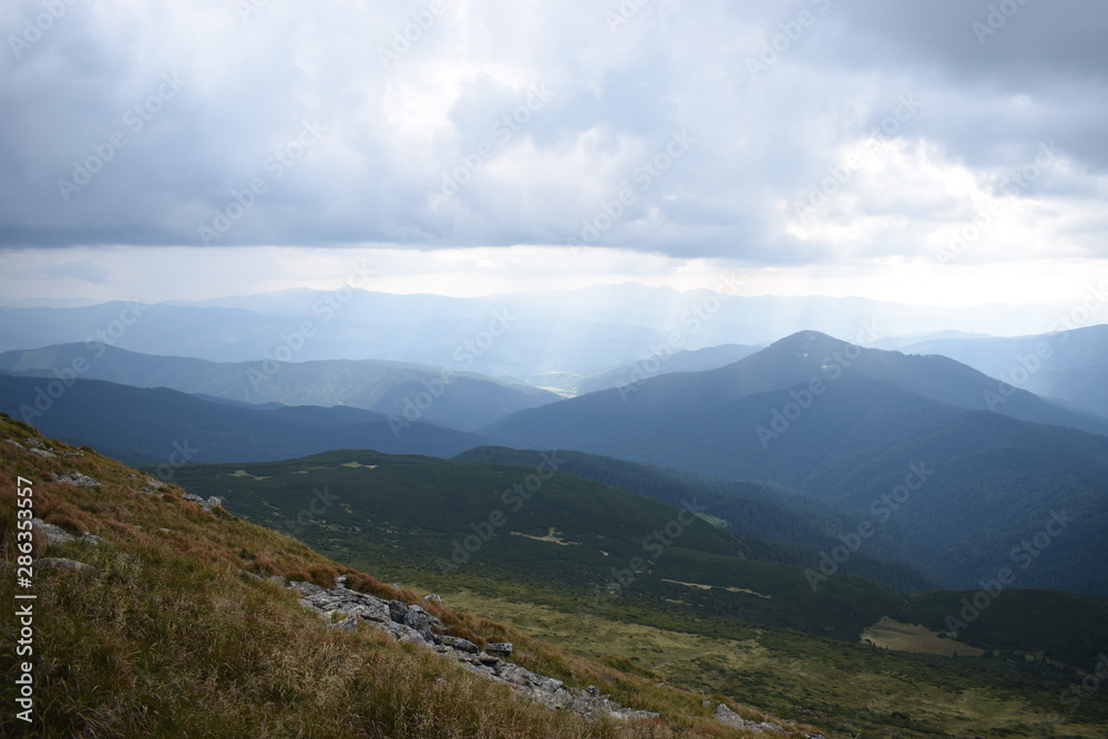 View while climbing Mount Hoverla. View of the mountain, forests and clouds. Ukrainian Carpathians.