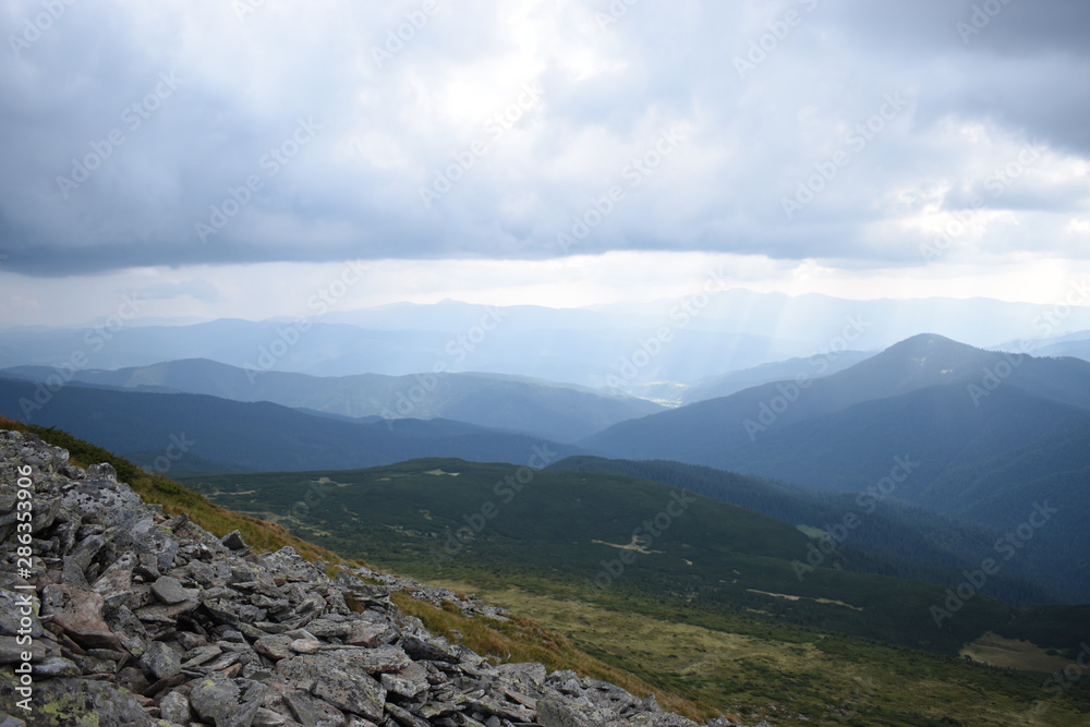 View while climbing Mount Hoverla. View of the mountain, forests and clouds. Ukrainian Carpathians.