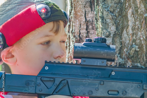 boy with a weapon for the game laser tag