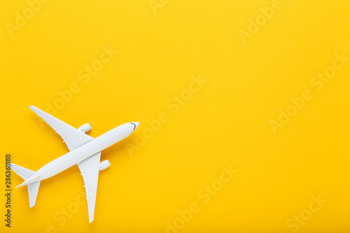 Airplane model on yellow background