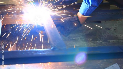 HD : Worker welding in factory
