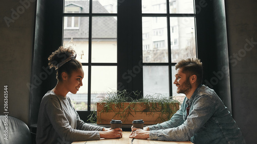 Reunion. Man and woman have a meeting in a modern cafe