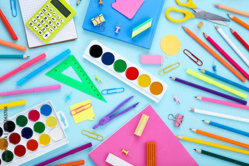 Different school supplies on blue background Different school supplies on blue background