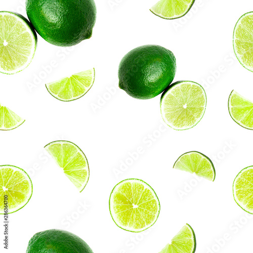 Seamless pattern of Juicy green lime, fruit slices and haft citrus isolated on white background. Healthy food concept