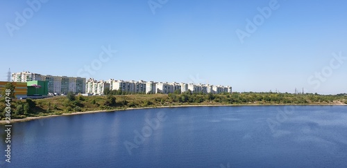 Apartments by the water. Houses by the water. Multi-storey houses near the water. © Binkontan