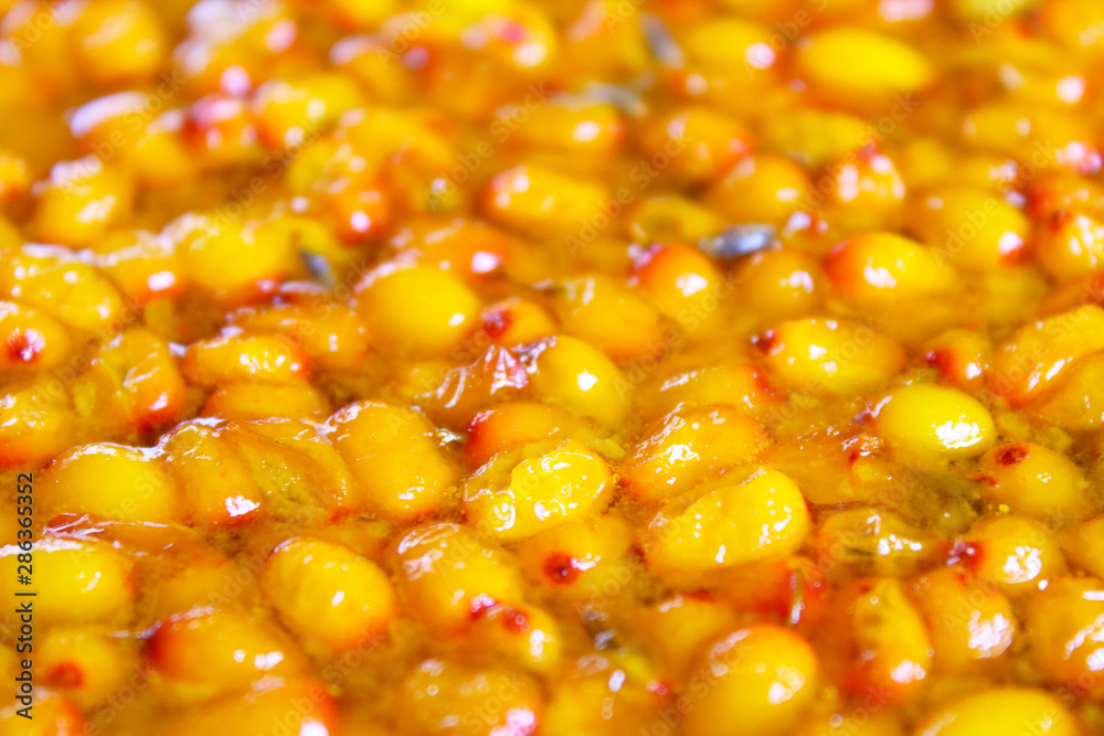 Fresh sea buckthorn jam. Close-up. Background. Texture. Fresh sea buckthorn jam. Close-up. Background. Texture.