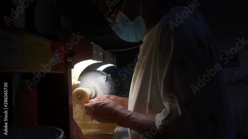 Dental Technician working on dentures photo