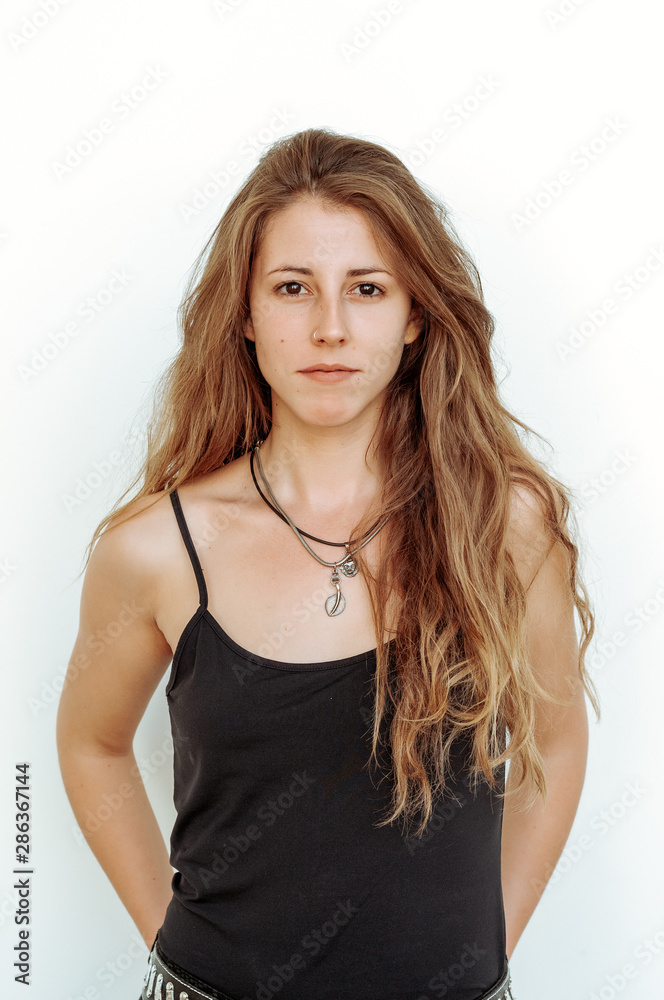 Blond girl photographed in an old building with white walls and natural poses. Blond girl photographed in an old building with white walls and natural poses.