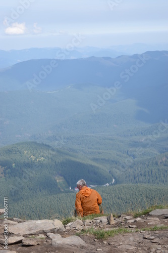 Tourist standing on Carpathian Mountains overlooking the Goverla view