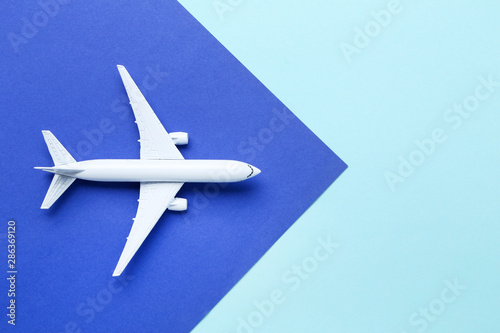 Airplane model on colorful paper background