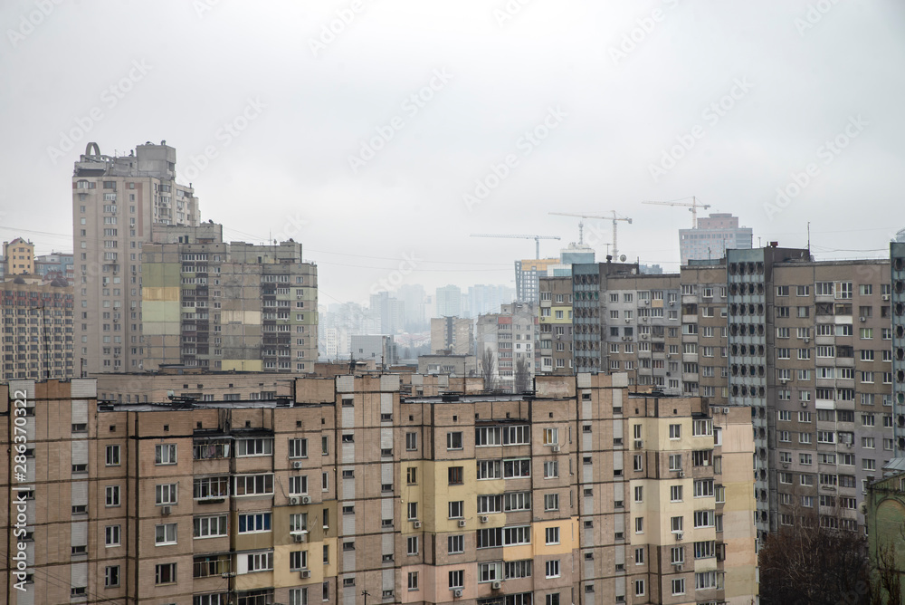 City jungle. Photo of a city with tall buildings. Visible fog in the distance City jungle. Photo of a city with tall buildings. Visible fog in the distance