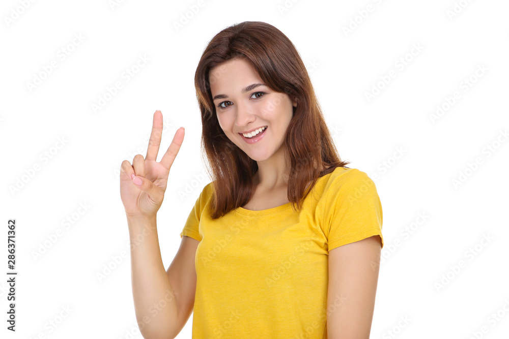 Young woman in yellow t-shirt on white background Young woman in yellow t-shirt on white background