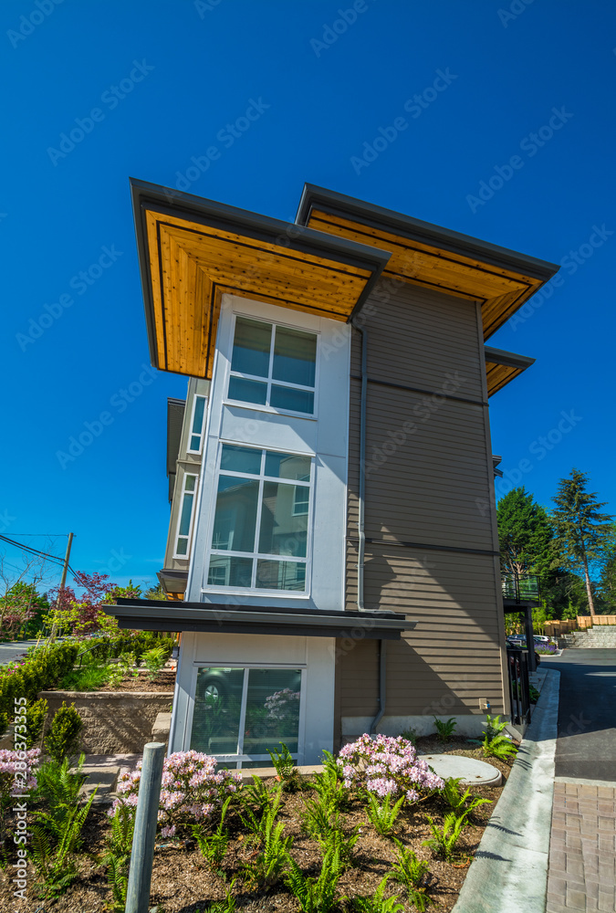 Brand new townhouse complex on sunny day in British Columbia.