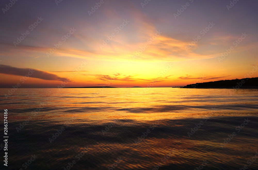 Beautiful late sunset with dusk and sunlight in yellow and orange color tone